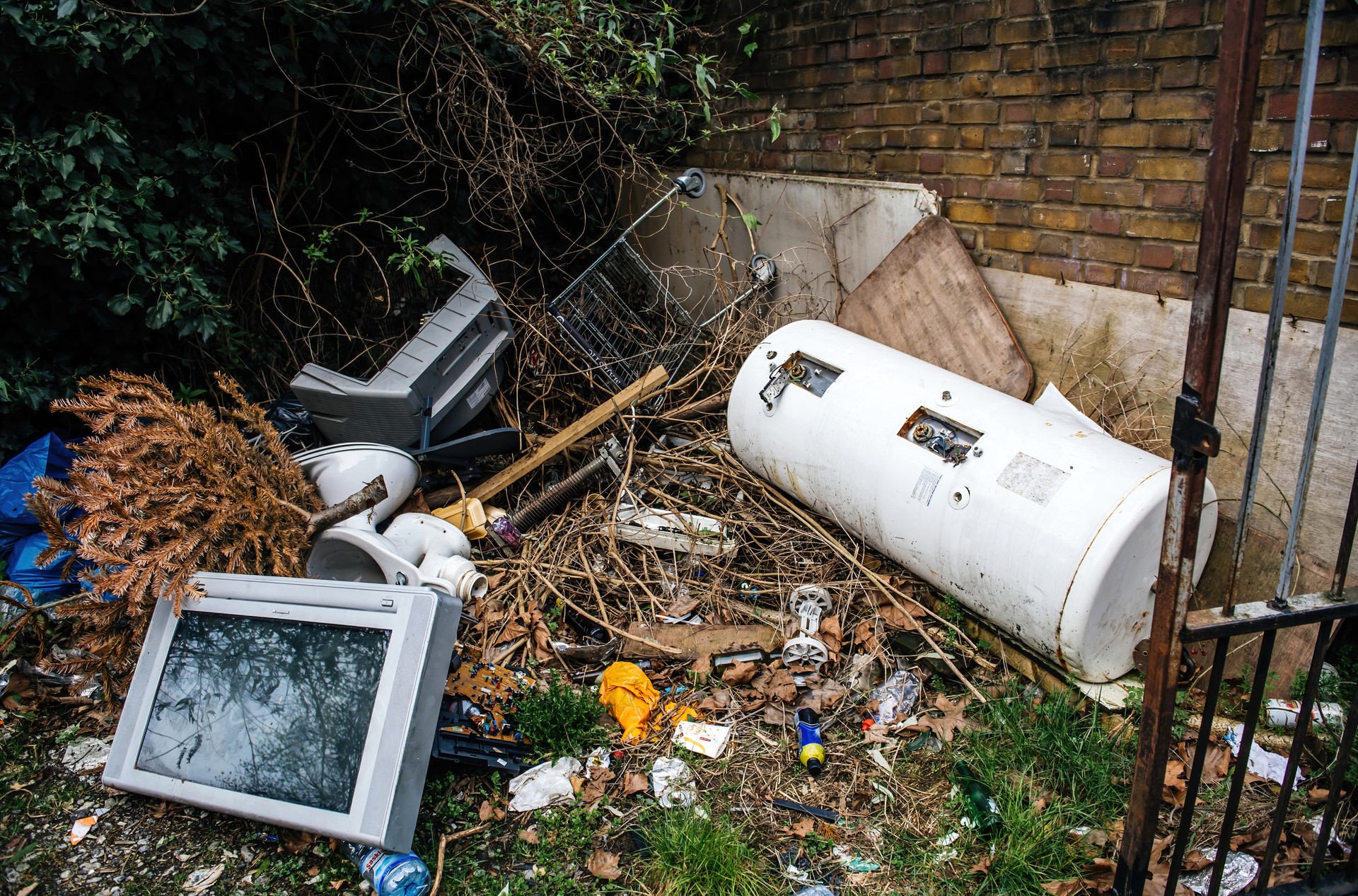 Waste near a building in the city of Westminster a tv set, water boiler