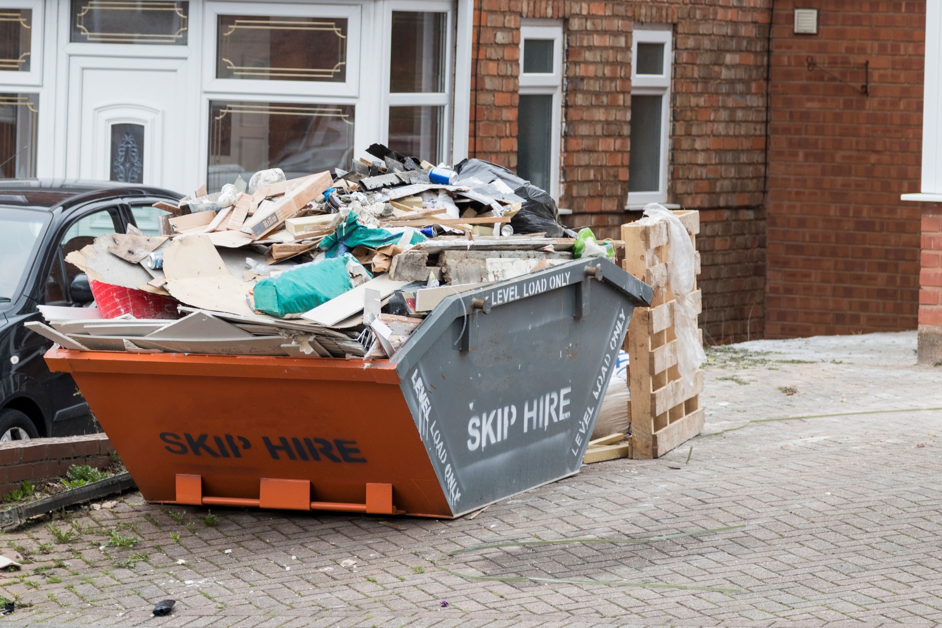 Street side skip filled with rubish
